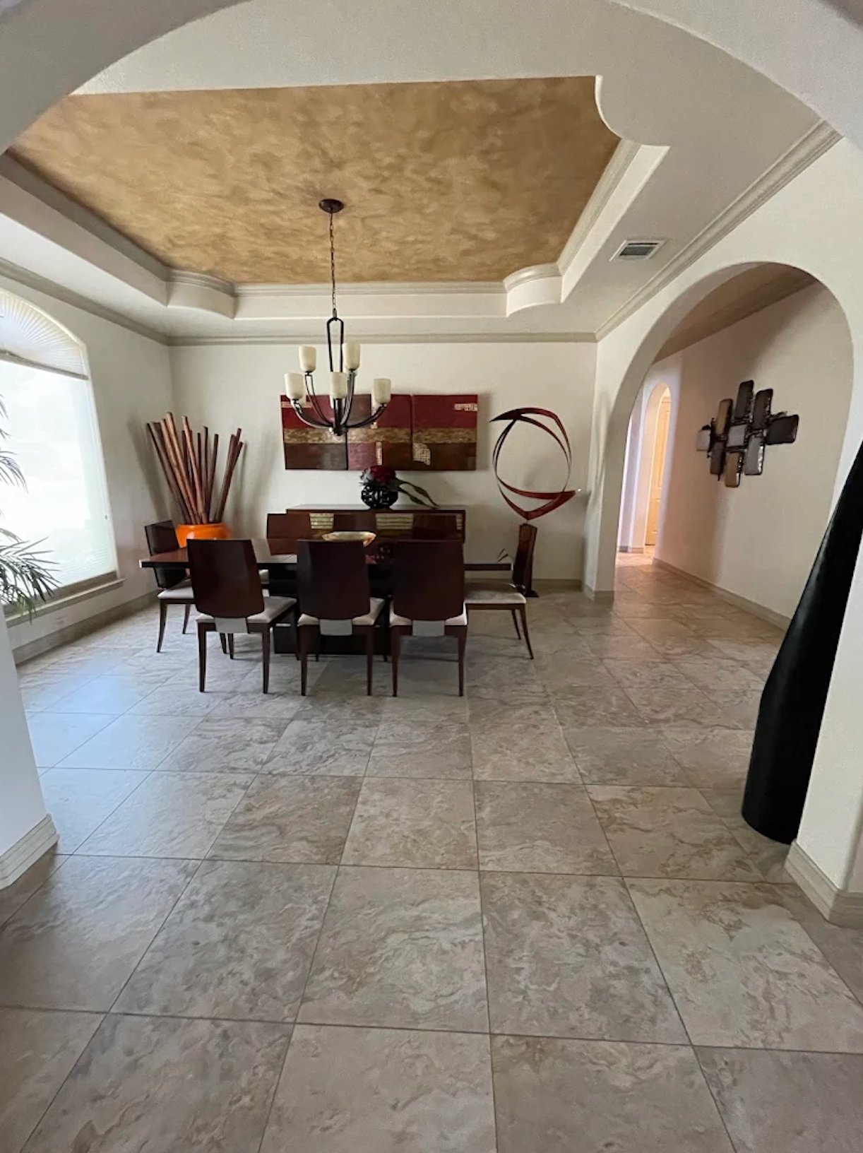 Dining room with faux-finish gold tray ceiling, archways, crown molding, and interior painting by Alphex Painting and Remodeling